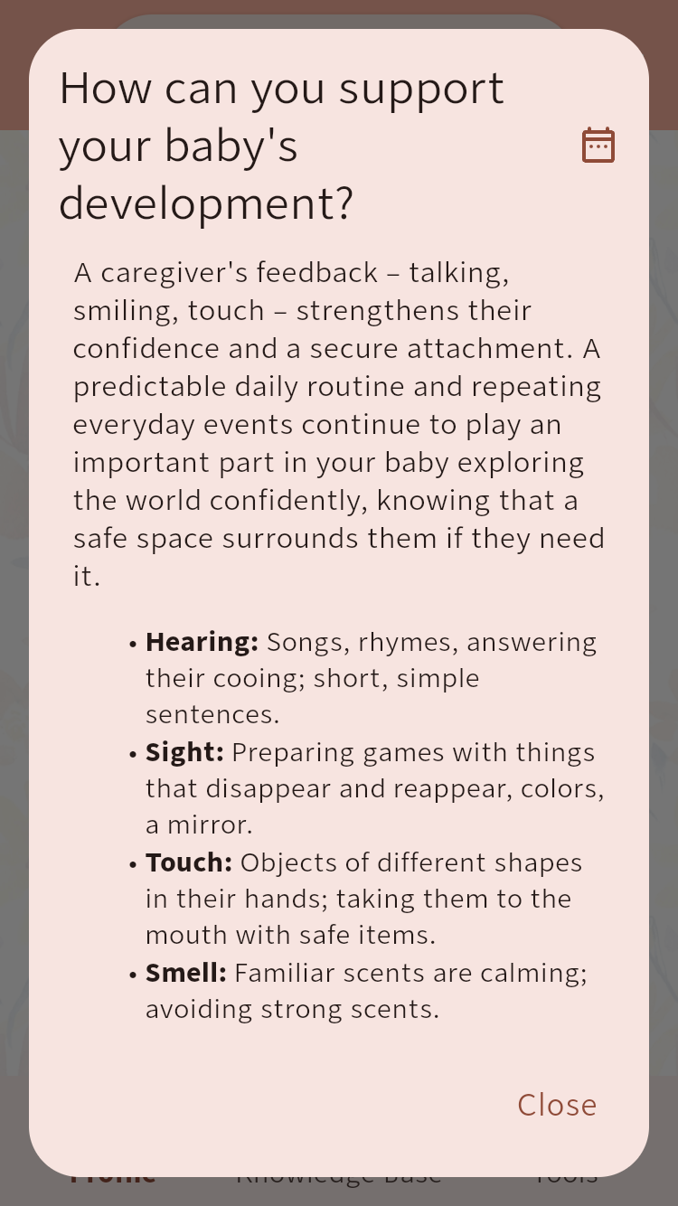 Baby development guidance dialog with suggestions for hearing, sight, touch and smell⁠.